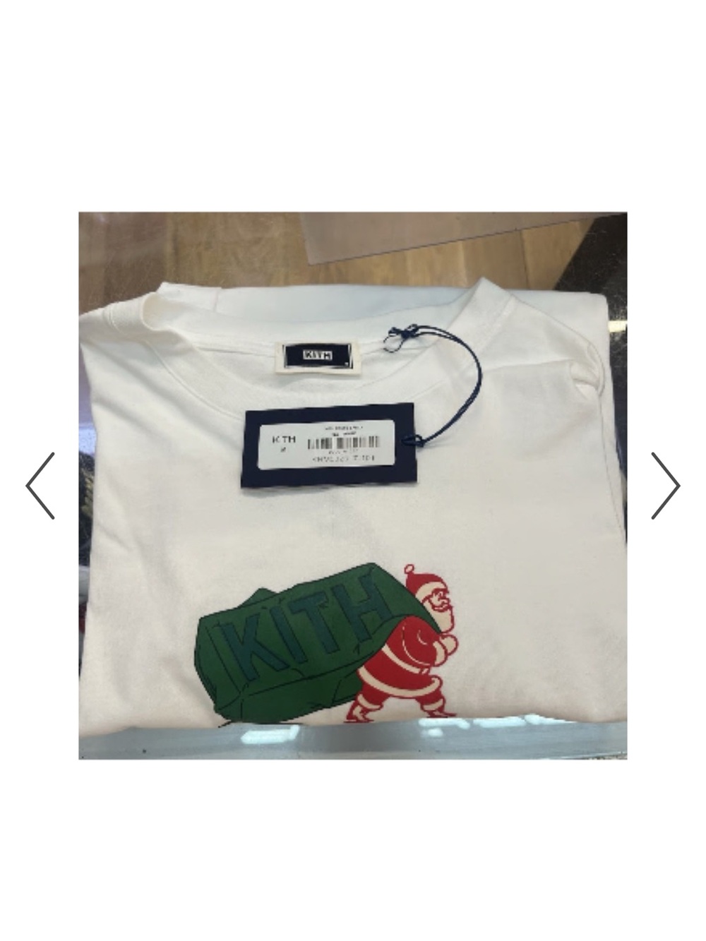 Kith White Tee with Green Logo and Red Santa Graphic